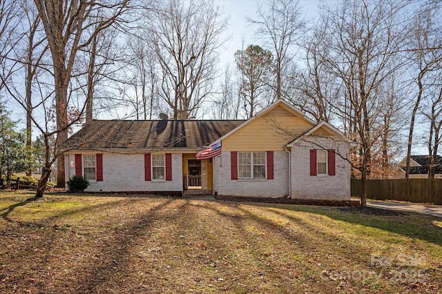 ranch-style house with a front lawn