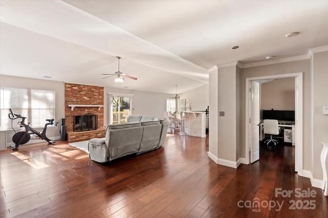 living room with a fireplace, dark hardwood / wood-style flooring, ceiling fan, and vaulted ceiling