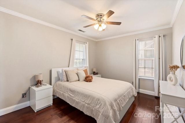 bedroom with ceiling fan, dark hardwood / wood-style flooring, ornamental molding, and multiple windows