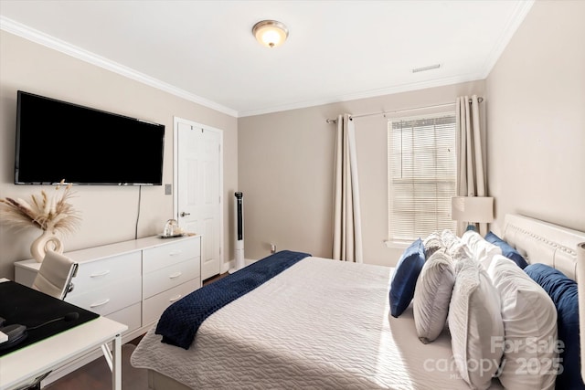 bedroom featuring crown molding