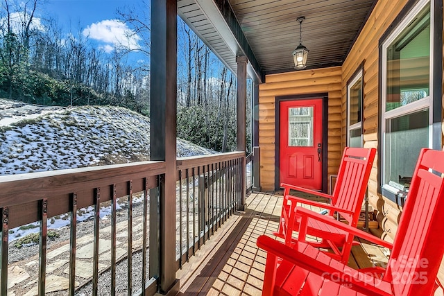 view of snow covered deck