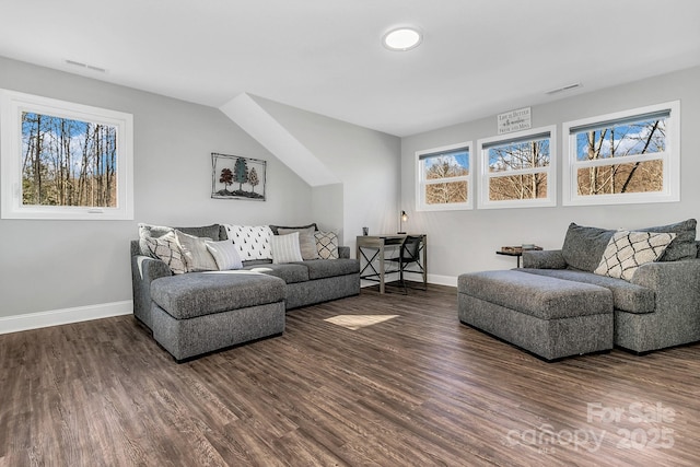 living room with a healthy amount of sunlight and dark hardwood / wood-style floors