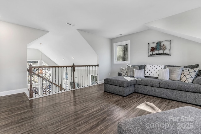 living room with dark wood-type flooring and lofted ceiling