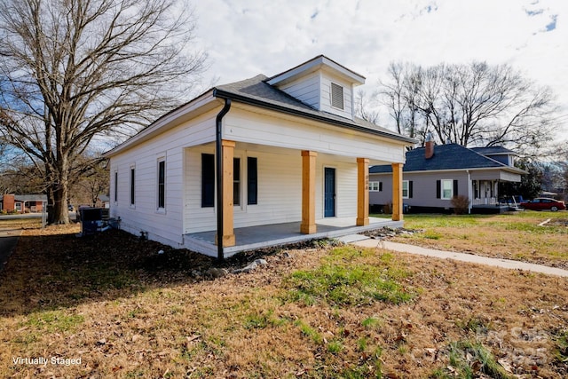 view of front of house featuring a front lawn and a porch