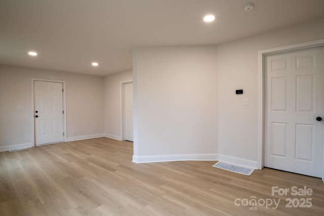 unfurnished room featuring light hardwood / wood-style flooring