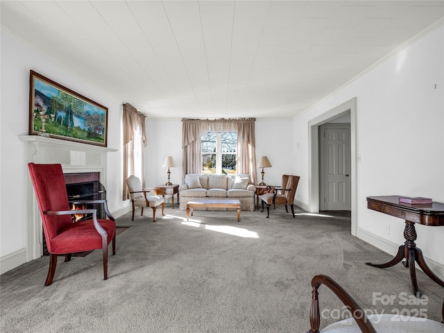 living room with crown molding, a brick fireplace, and carpet flooring