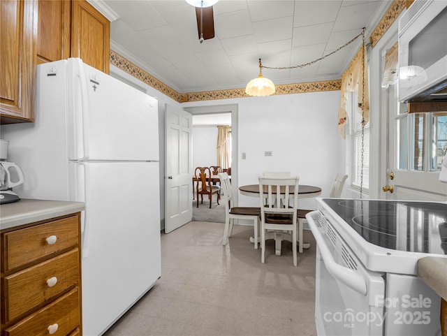 266 Hudlow Rd, Forest City, NC 28043 - kitchen with ornamental molding, pendant lighting, and white appliances