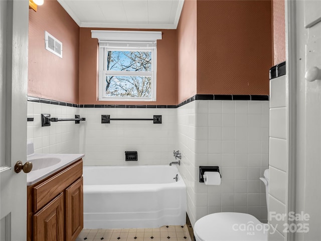 266 Hudlow Rd, Forest City, NC 28043 - bathroom featuring tile walls, vanity, a bathtub, and crown molding