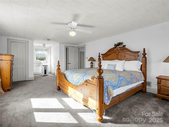 266 Hudlow Rd, Forest City, NC 28043 - bedroom with crown molding, ceiling fan, and dark carpet