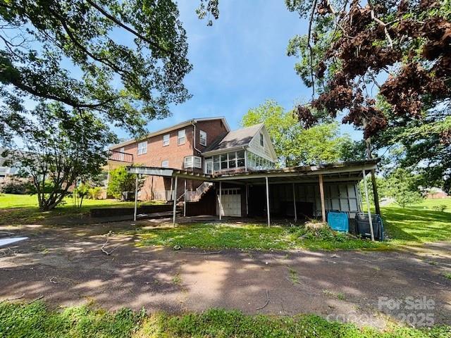 266 Hudlow Rd, Forest City, NC 28043 - rear view of house with a garage, stairway, and a deck