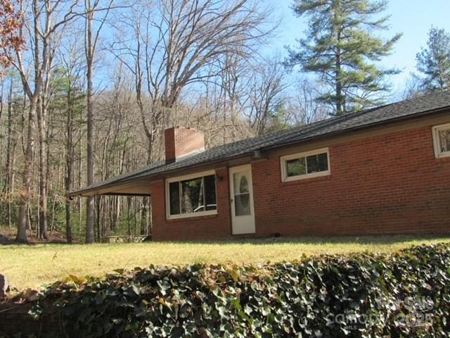 back of house featuring a yard