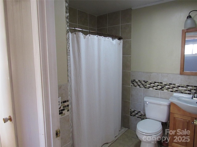 bathroom featuring vanity, tile walls, tile patterned floors, and a shower with shower curtain