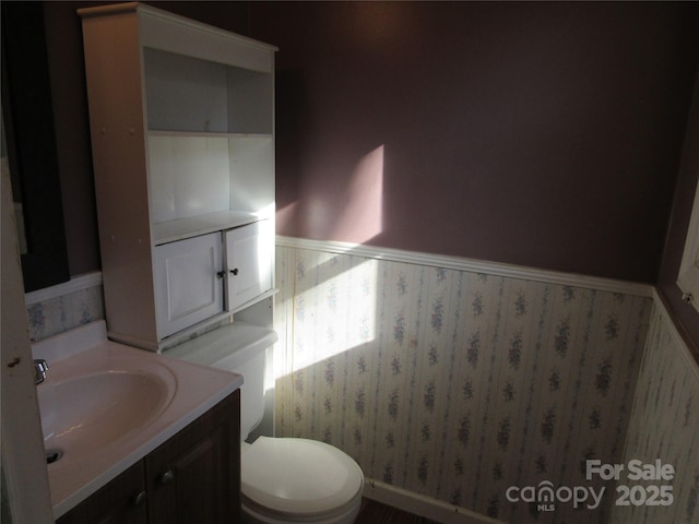 bathroom with vanity and toilet