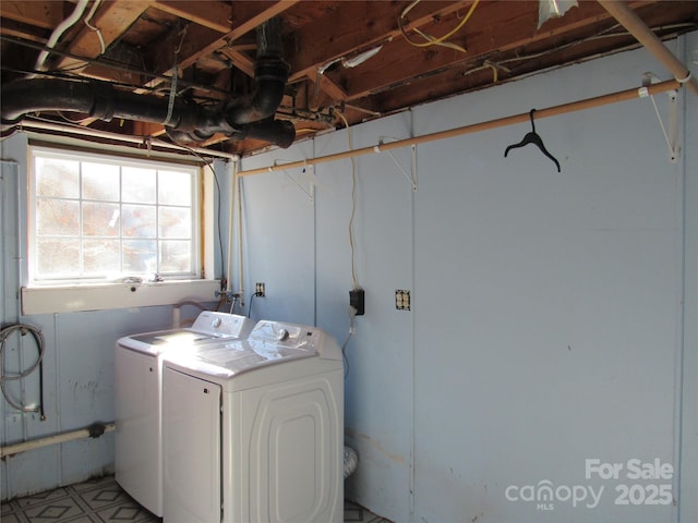 clothes washing area featuring washing machine and dryer