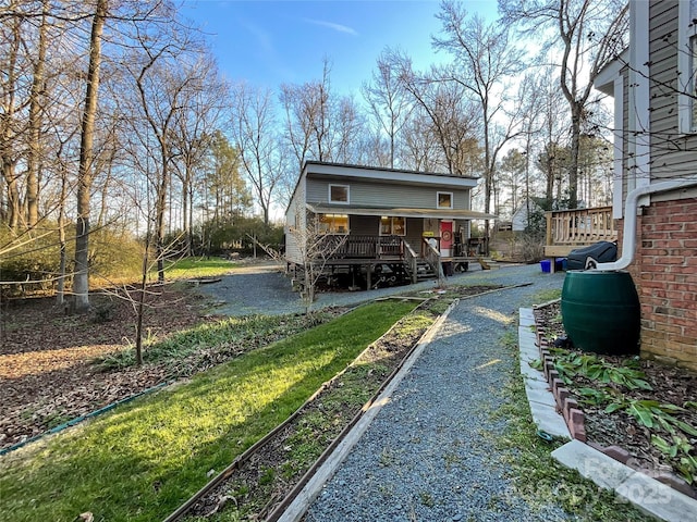 back of house featuring a wooden deck