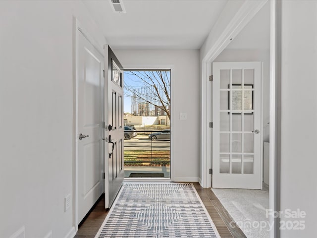 foyer entrance featuring hardwood / wood-style flooring