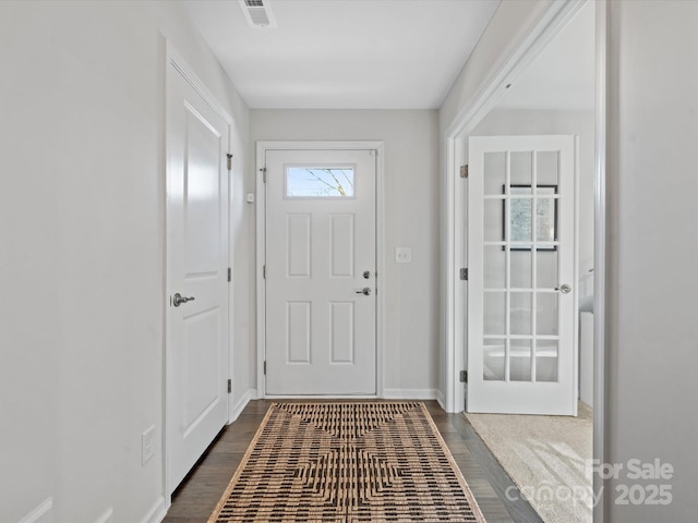 entryway featuring dark wood-type flooring