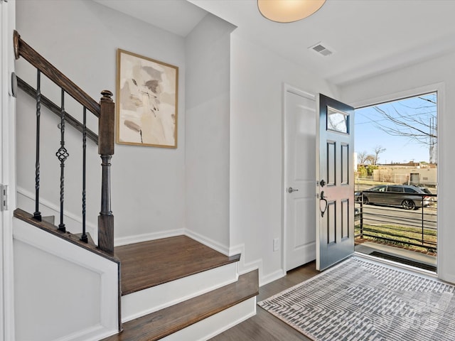 foyer entrance featuring dark wood-type flooring