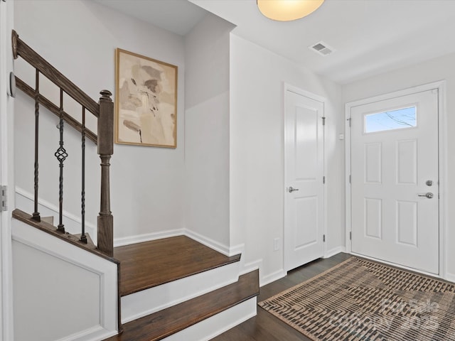 foyer with dark hardwood / wood-style flooring