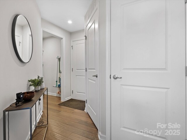 corridor featuring hardwood / wood-style flooring