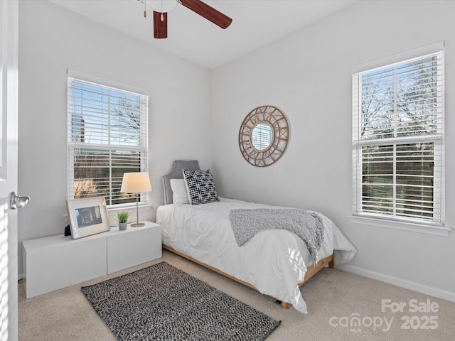 carpeted bedroom with ceiling fan