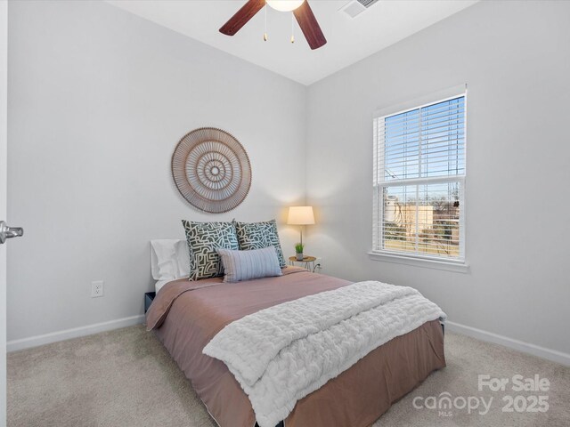 carpeted bedroom featuring ceiling fan