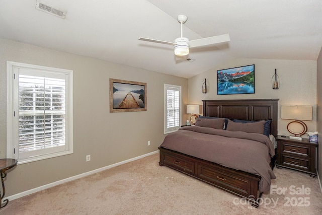 bedroom with vaulted ceiling, ceiling fan, and light carpet