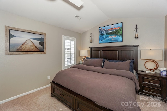 carpeted bedroom with vaulted ceiling