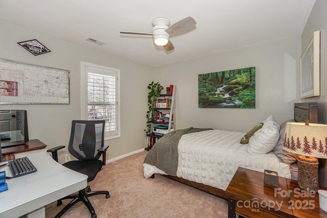 bedroom featuring ceiling fan and light colored carpet