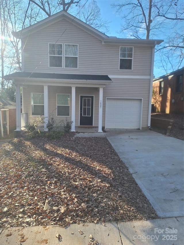 front facade featuring a porch and a garage