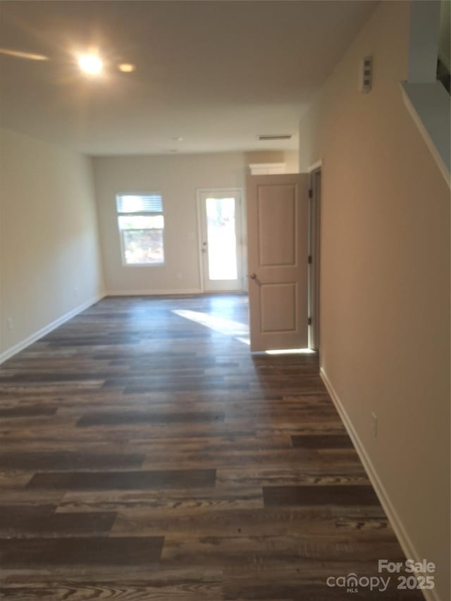 interior space with dark hardwood / wood-style flooring