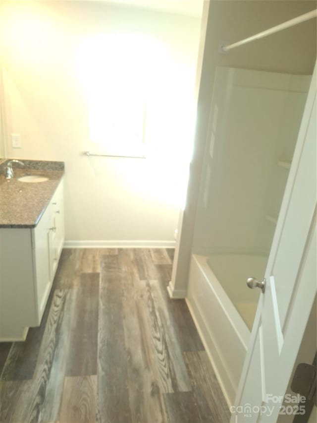 bathroom with vanity and wood-type flooring