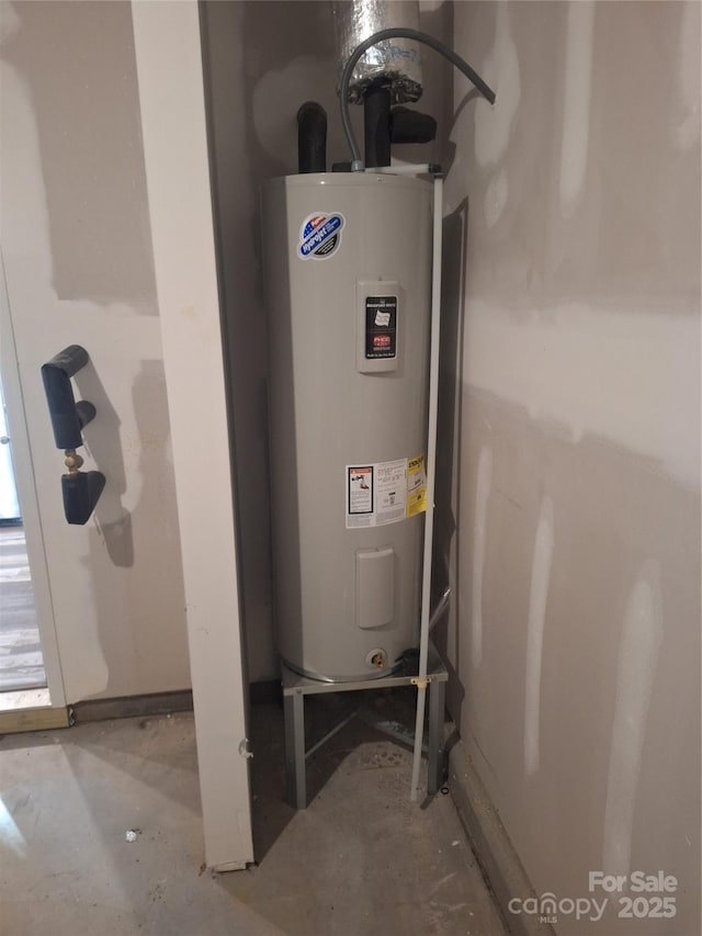 utility room featuring electric water heater