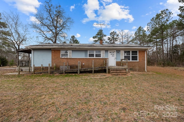 ranch-style home with a front lawn