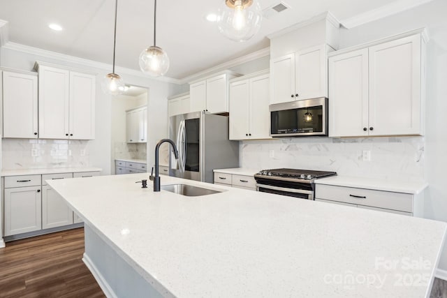 kitchen with visible vents, appliances with stainless steel finishes, a sink, and white cabinetry