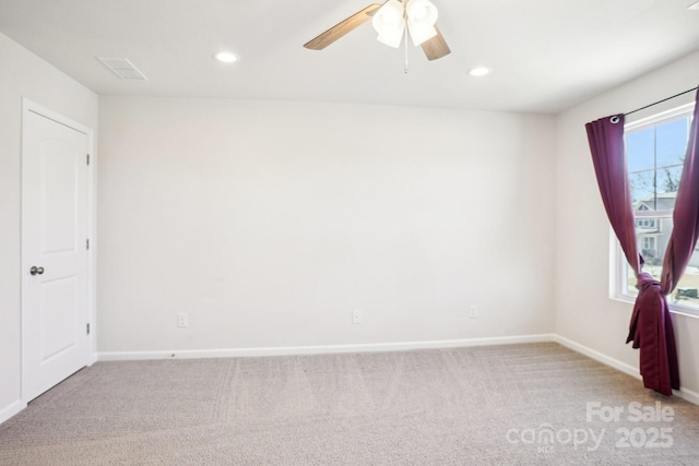 unfurnished room with recessed lighting, light carpet, a ceiling fan, baseboards, and visible vents