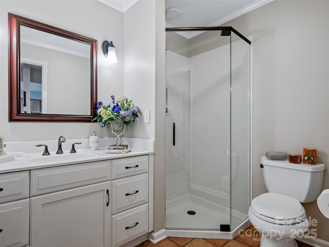 bathroom with crown molding, vanity, a shower with shower door, tile patterned floors, and toilet