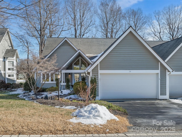 view of front of property featuring a garage