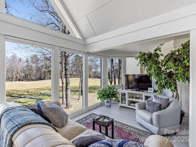 sunroom with high vaulted ceiling