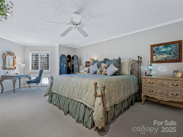 carpeted bedroom with ornamental molding, ceiling fan, and a textured ceiling