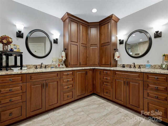 full bathroom featuring double vanity, a sink, and recessed lighting