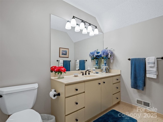 bathroom featuring tile patterned floors, toilet, vanity, lofted ceiling, and visible vents