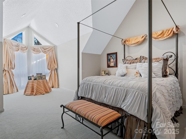 bedroom featuring lofted ceiling, carpet, and a textured ceiling