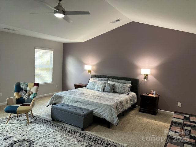 carpeted bedroom with vaulted ceiling and ceiling fan