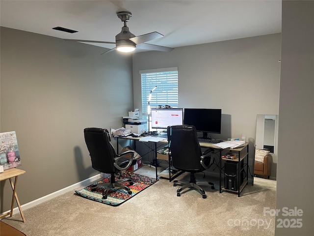 carpeted home office with ceiling fan