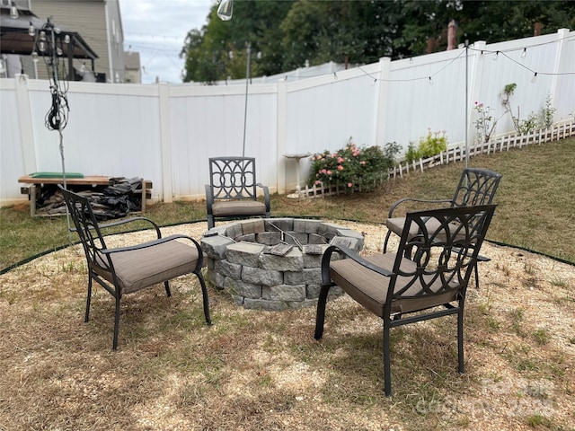 view of patio / terrace with a fire pit