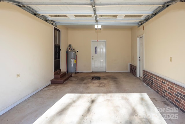 garage with electric water heater and a garage door opener