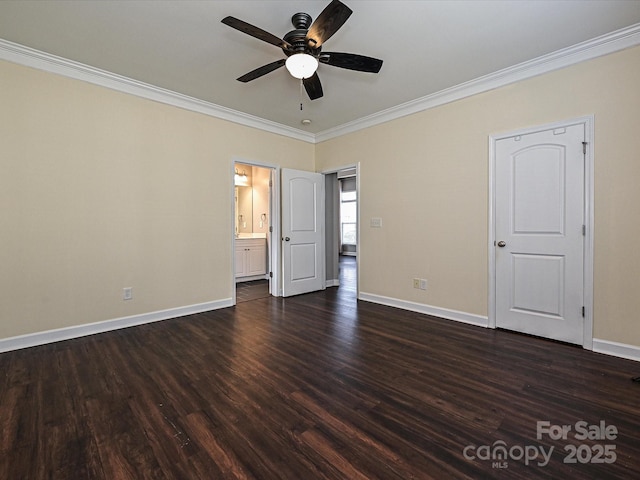 unfurnished bedroom with ensuite bathroom, ceiling fan, crown molding, and dark wood-type flooring