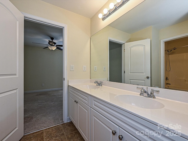 bathroom with vanity, ceiling fan, and washtub / shower combination