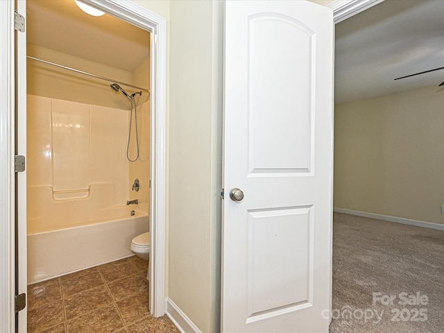 bathroom with toilet and shower / washtub combination